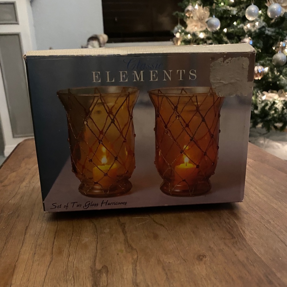 A Set of Two Hurricane Candle Holders